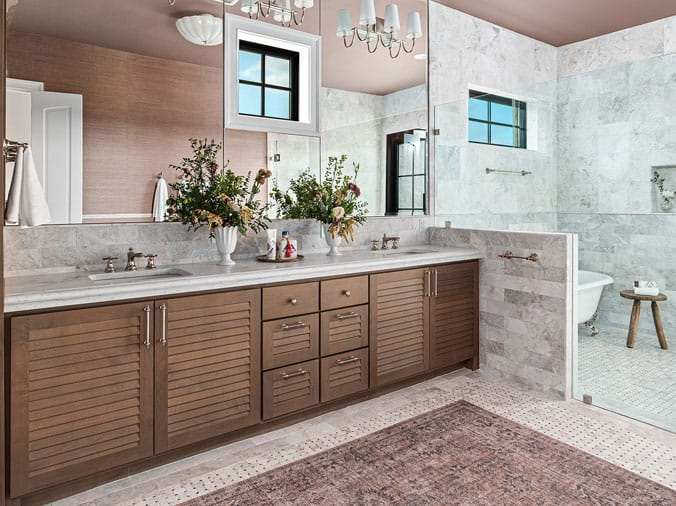 bathroom with wood cabinets and stone countertop