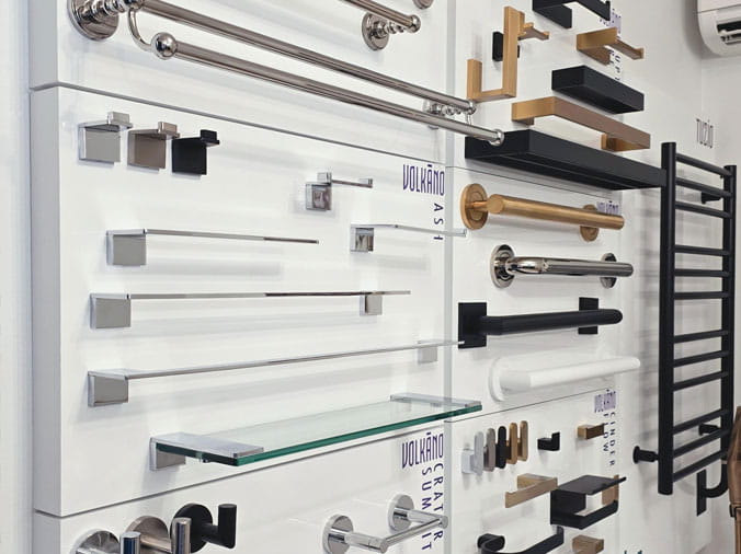 Bathroom hardware display with towel racks and shelves