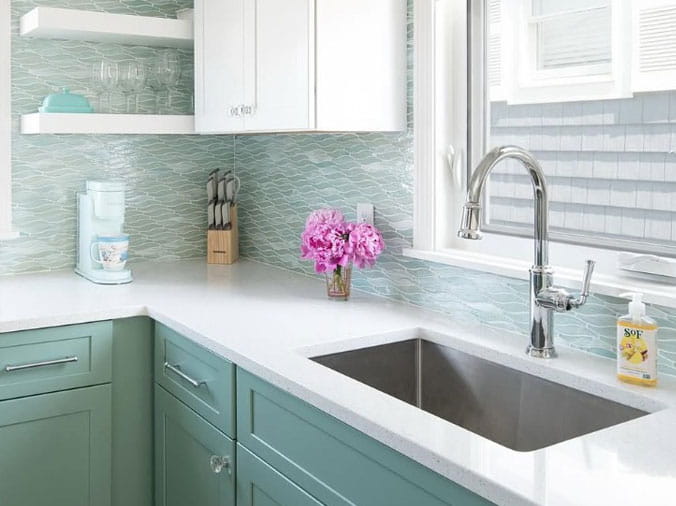 Kitchen with aqua cabinets and brushed stainless faucet
