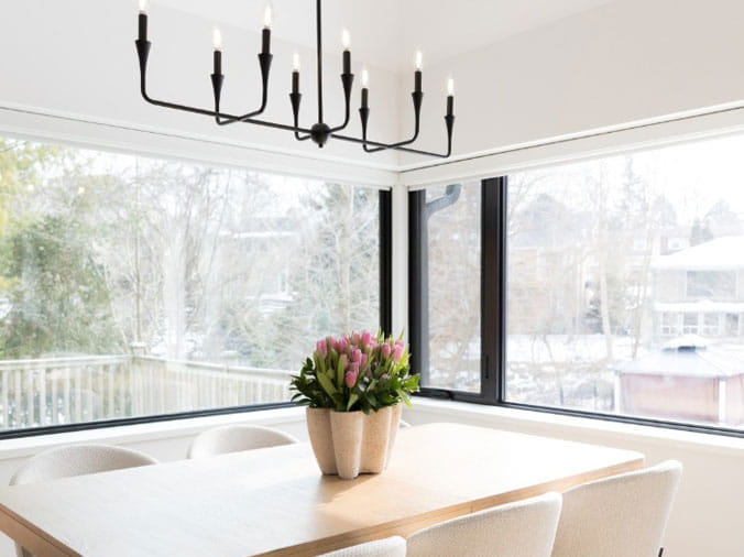 Dining area with black hanging lights