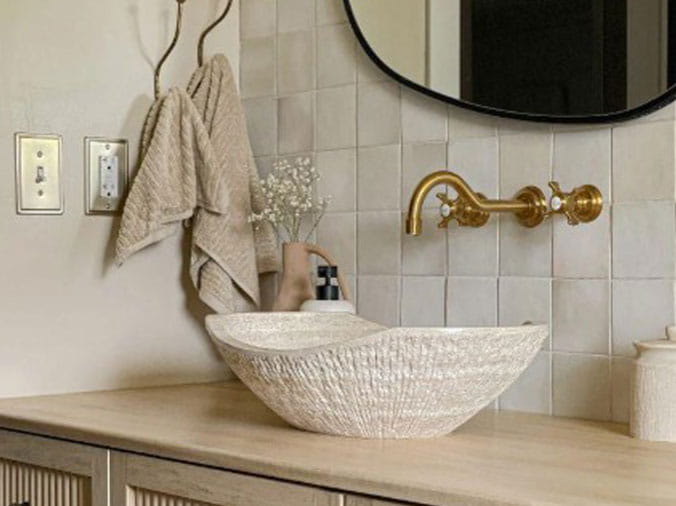 Fancy basin sink with brushed brass faucet