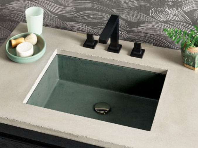 Square bathroom sink with black faucet