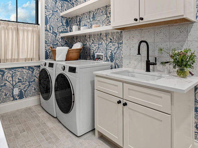 Laundry room with sink with black faucet