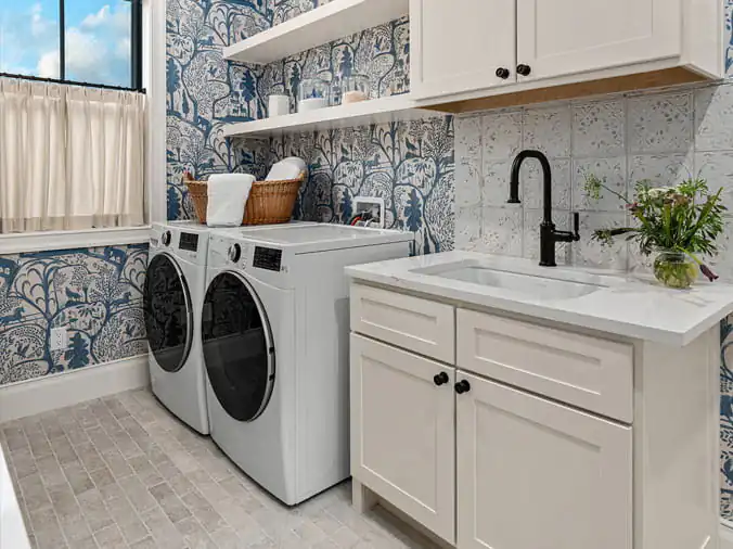 Laundry room with sink with black faucet